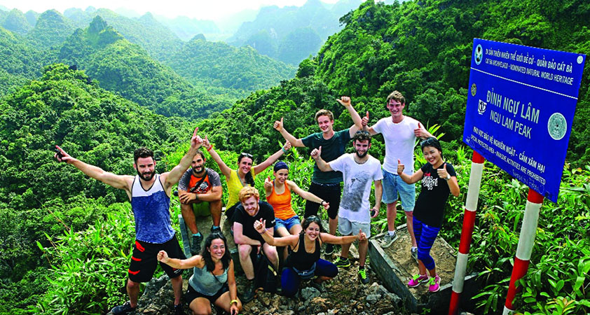 Tourists getting excited during the trekking tour in Cat Ba Island National Park