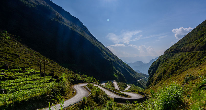 The loop winding among the green landscape of green mountains and blue sky