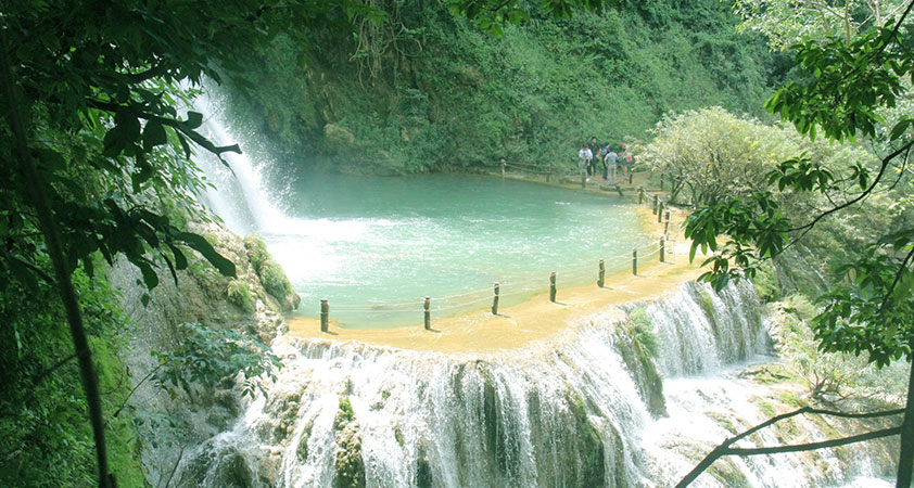 Immerse in the blue water in the waterfall