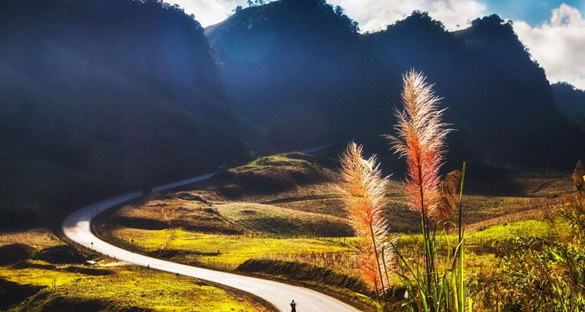 The mountainous roadway becomes more impressive at dawn