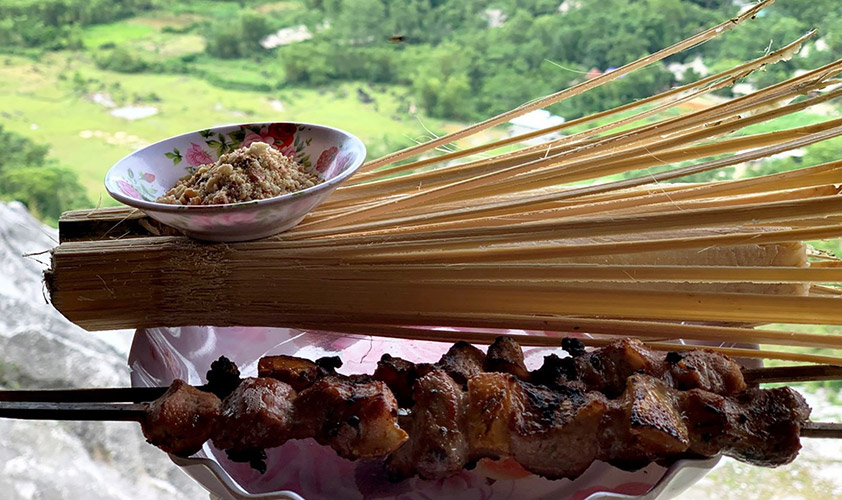 Rice is cooked in bammbo tube and enjoyed with roasted meat