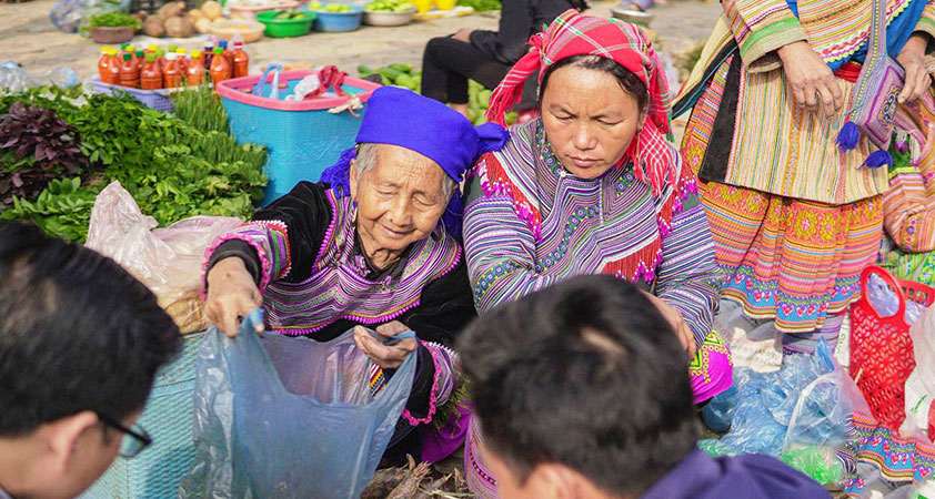 Local people go to market in traditional costume