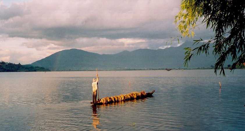 Framed by low mountains, the lake is home to many varieties of wading birds