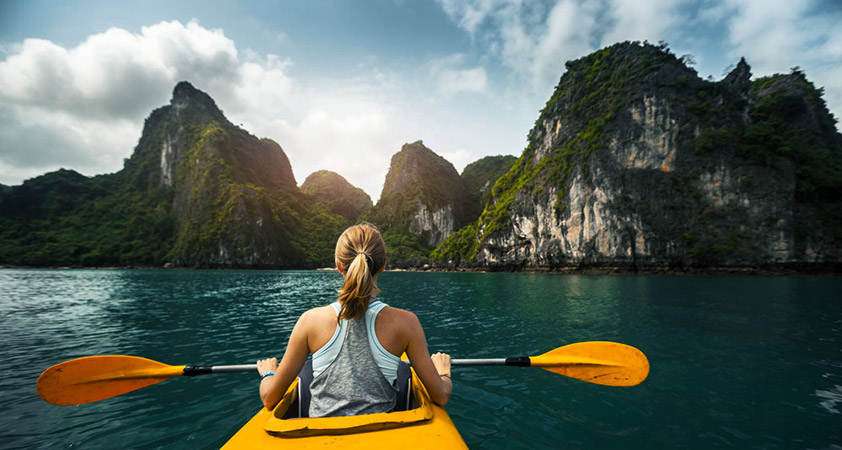 Paddling by kayak around the stunning Halong Bay 