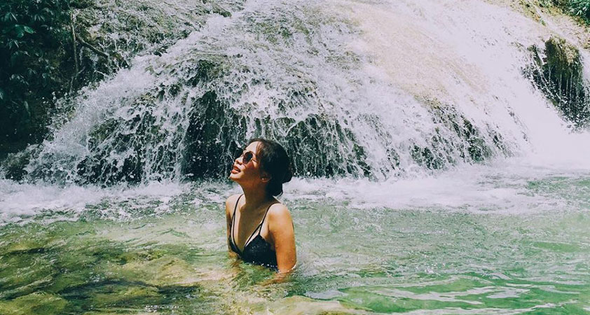 Immerse in the fresh water below the waterfall