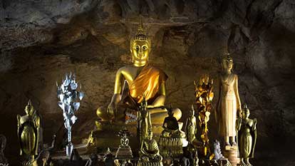Pak Ou caves - Caves in the cliffs on the Mekong filled with 1000’s of Buddha images