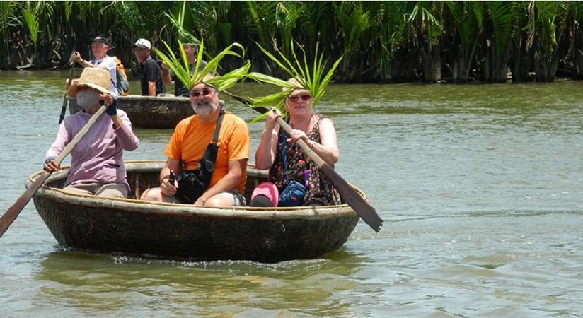Visitors can see the beautiful coconut forests by sitting on the typical boat of Halong