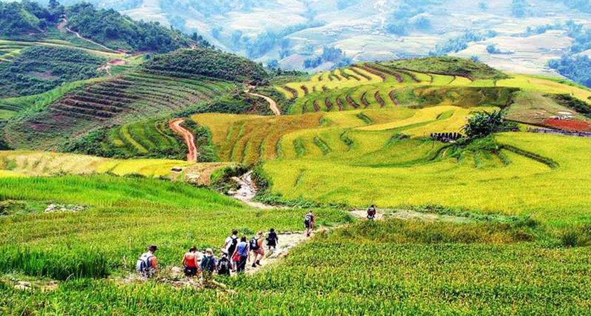 Trekking through mountainous landscapes of Sapa to reach ethnic villages